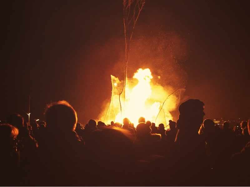 People watching a bonfire